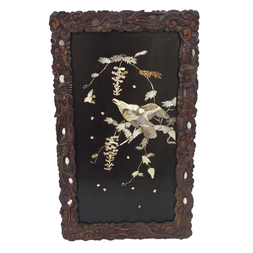 310 - A Japanese lacquered and inlaid mother of pearl wall panel