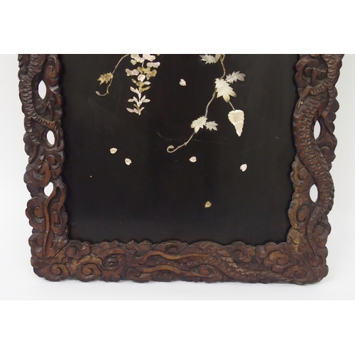 310 - A Japanese lacquered and inlaid mother of pearl wall panel