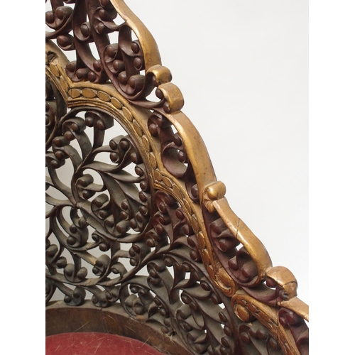 325 - An Anglo Indian carved  pierced and gilt armchair