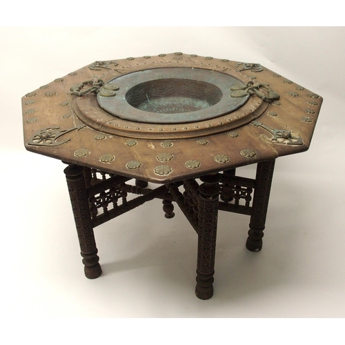 332 - A Persian copper octagonal hardwood wash basin