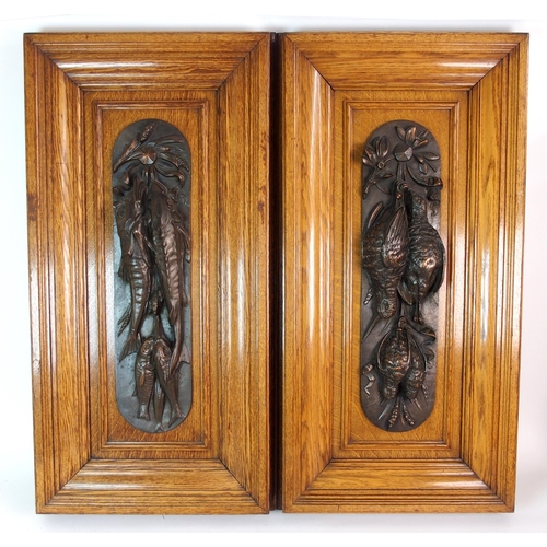 336 - A pair of bronze wall plaques