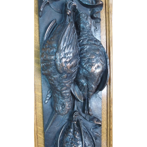 336 - A pair of bronze wall plaques