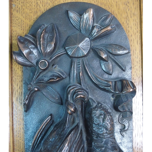 336 - A pair of bronze wall plaques