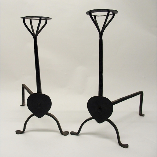 339 - A pair of Arts and Crafts wrought iron fire dogs