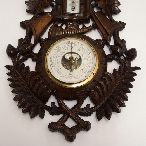 346 - A black forest stained barometer and thermometer