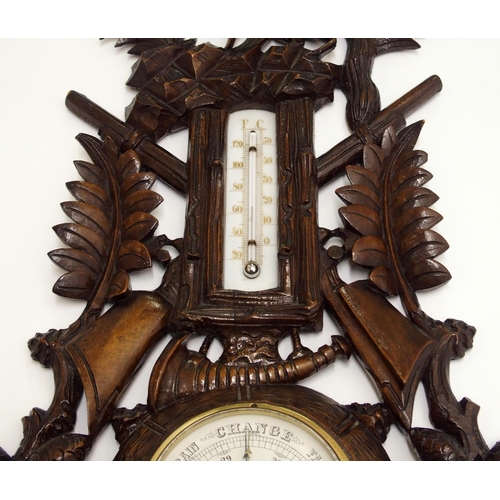 346 - A black forest stained barometer and thermometer