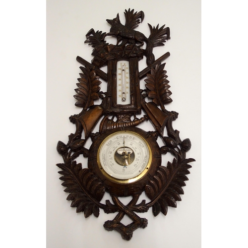 346 - A black forest stained barometer and thermometer