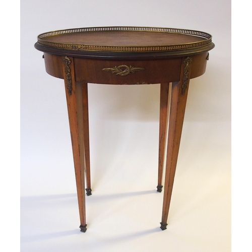 364 - A French mahogany and brass mounted oval occasional table