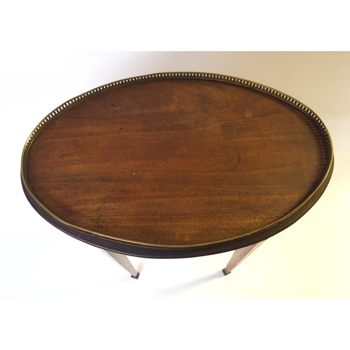 364 - A French mahogany and brass mounted oval occasional table