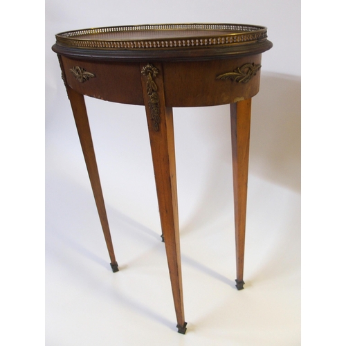 364 - A French mahogany and brass mounted oval occasional table