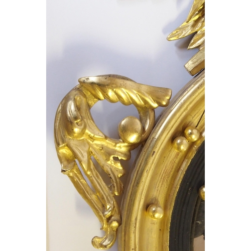 366 - A 19th Century giltwood and gesso convex circular wall mirror