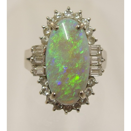 486 - An 18ct white gold opal and diamond ring