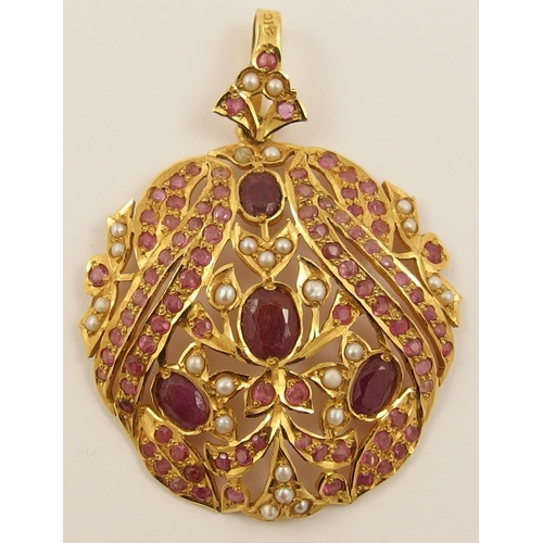 491 - A 22ct ruby and pearl set pendant of Arabic floral design