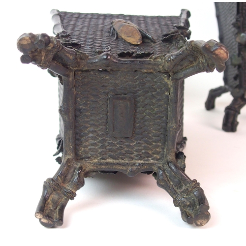 67 - A pair of Japanese bronze square shaped vases