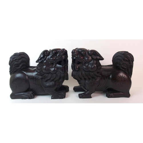 68 - A pair of Chinese ebonised dogs of Fo