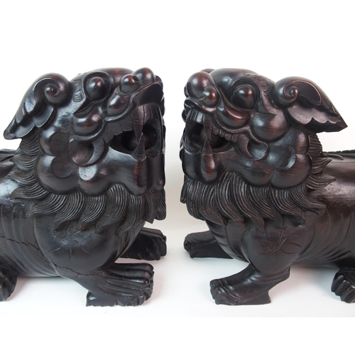 68 - A pair of Chinese ebonised dogs of Fo