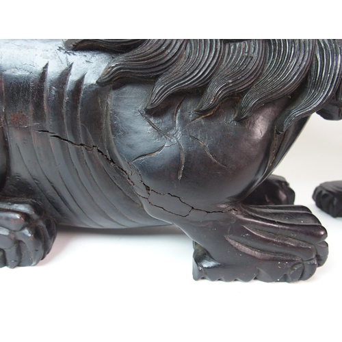 68 - A pair of Chinese ebonised dogs of Fo