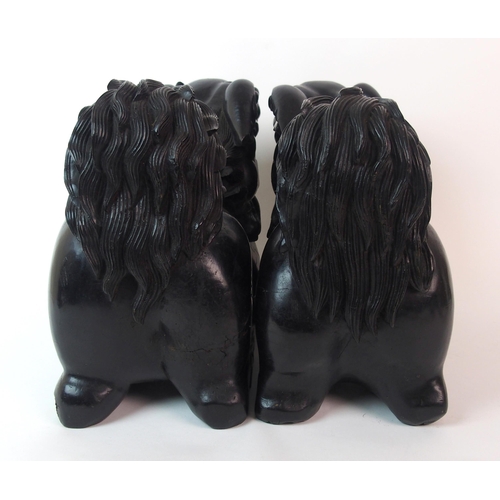 68 - A pair of Chinese ebonised dogs of Fo