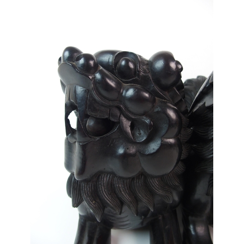 68 - A pair of Chinese ebonised dogs of Fo