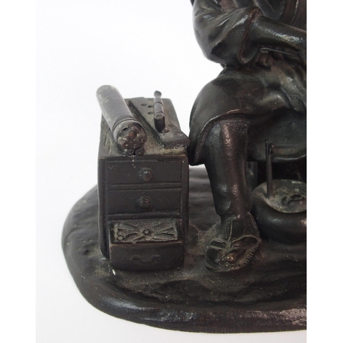 74 - A Japanese bronze of an itinerant worker