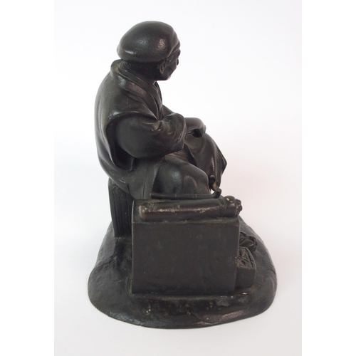 74 - A Japanese bronze of an itinerant worker