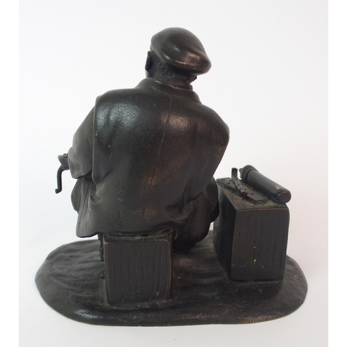 74 - A Japanese bronze of an itinerant worker