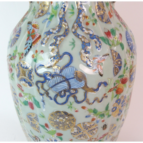 76 - A Chinese famille rose celadon ground baluster vase