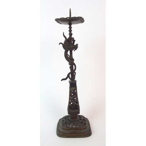 84 - A Chinese pierced bronze pricket candlestick