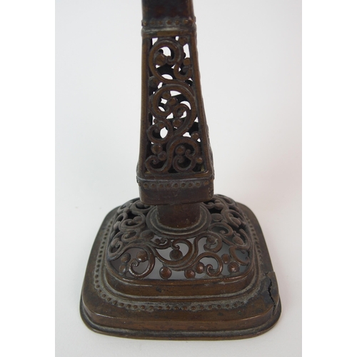 84 - A Chinese pierced bronze pricket candlestick