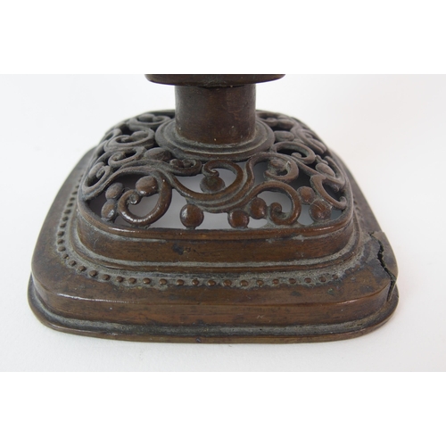 84 - A Chinese pierced bronze pricket candlestick