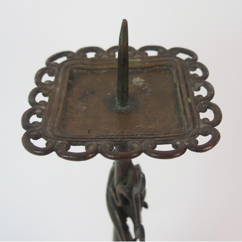 84 - A Chinese pierced bronze pricket candlestick