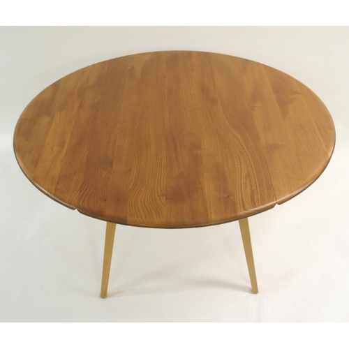 1002 - An Ercol oval drop-leaf table