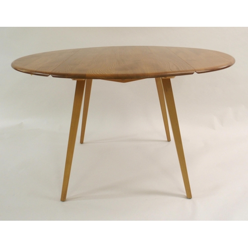 1002 - An Ercol oval drop-leaf table