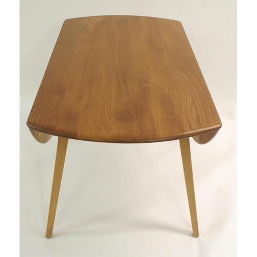 1002 - An Ercol oval drop-leaf table