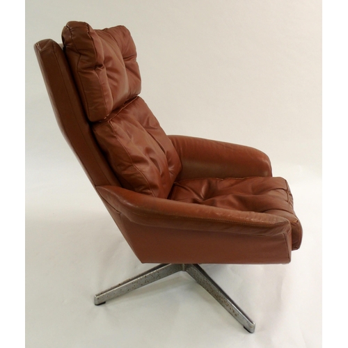 1006 - A 1960's brown leather button back swivel chair