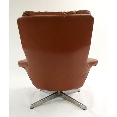 1006 - A 1960's brown leather button back swivel chair