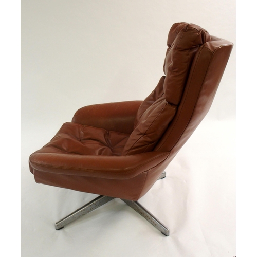 1006 - A 1960's brown leather button back swivel chair