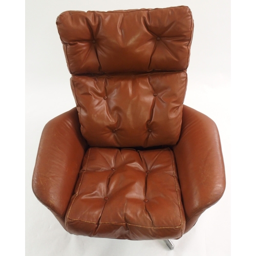 1006 - A 1960's brown leather button back swivel chair