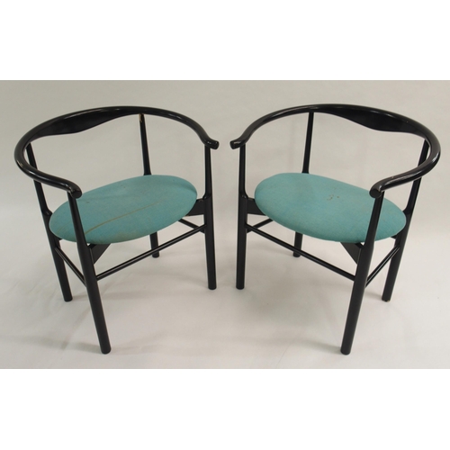 1007 - A pair of black Danish armchairs