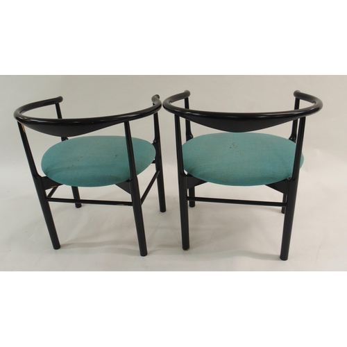 1007 - A pair of black Danish armchairs