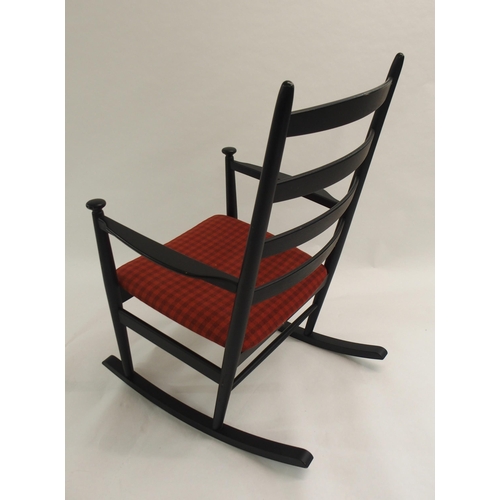 1009 - A Danish style black ladderback rocking chair