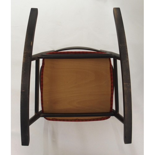 1009 - A Danish style black ladderback rocking chair