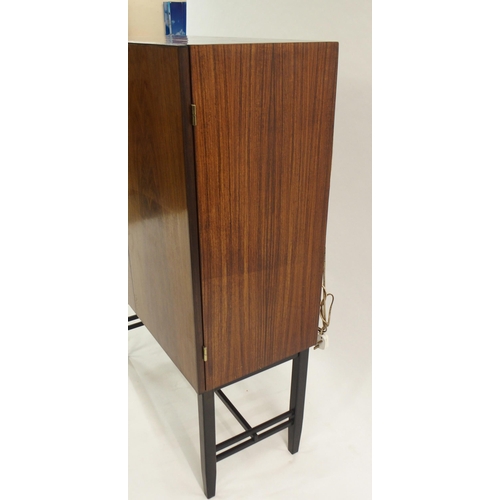 1010 - A 1960's rosewood veneer two door cocktail cabinet