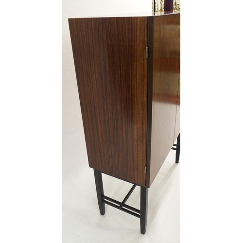 1010 - A 1960's rosewood veneer two door cocktail cabinet