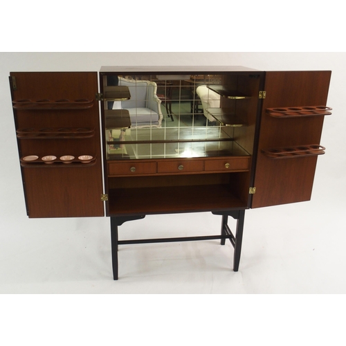 1010 - A 1960's rosewood veneer two door cocktail cabinet