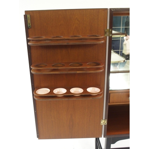 1010 - A 1960's rosewood veneer two door cocktail cabinet