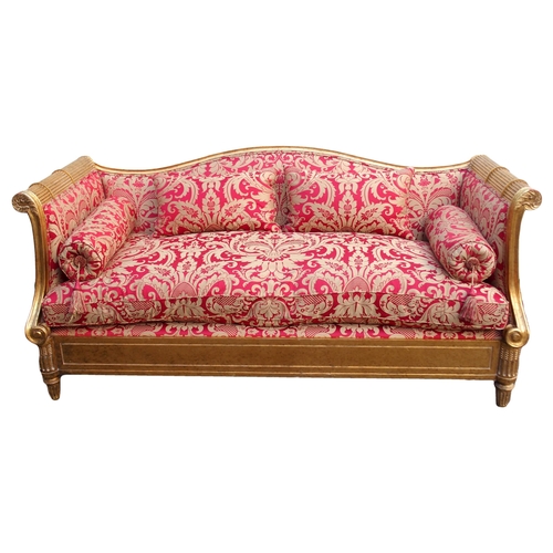 1018 - A modern gilt framed Reims sofa