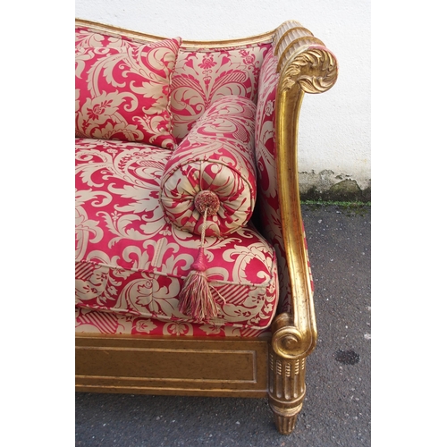 1018 - A modern gilt framed Reims sofa