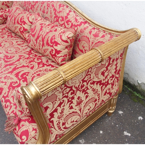 1019 - A modern gilt framed Reims sofa