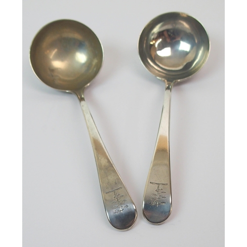 250 - A pair of George III silver sauce ladles